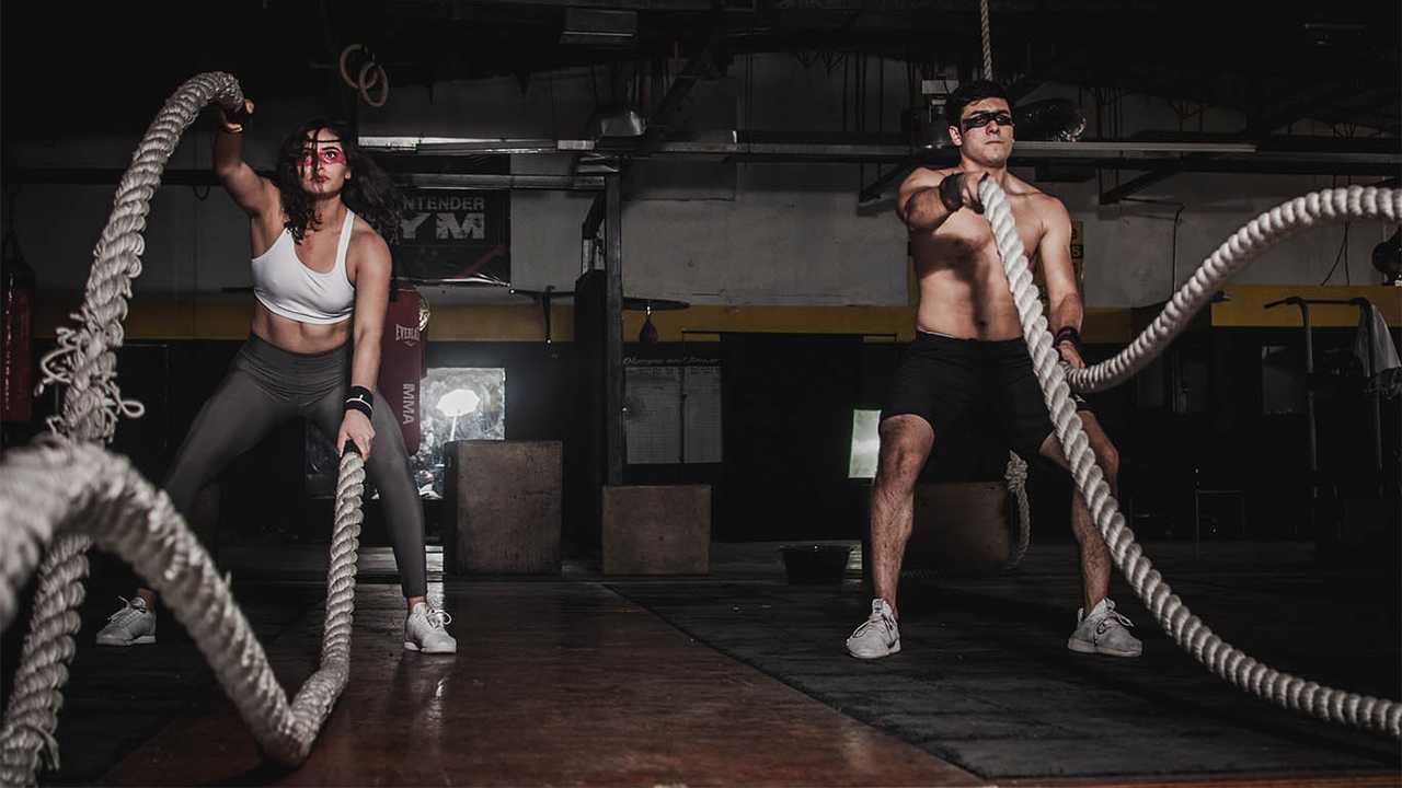 GymCoach Project Image: Two persons working out in a gym